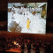 Roller Screen System MEGASCREEN with layer made from front projection screen SCENE and touch screen control.<br>Dimensions of the screen: approx. 12.0 x 15.0 m (13.1 x 16.4 yd).<br>Kulturpalast Dresden / Germany